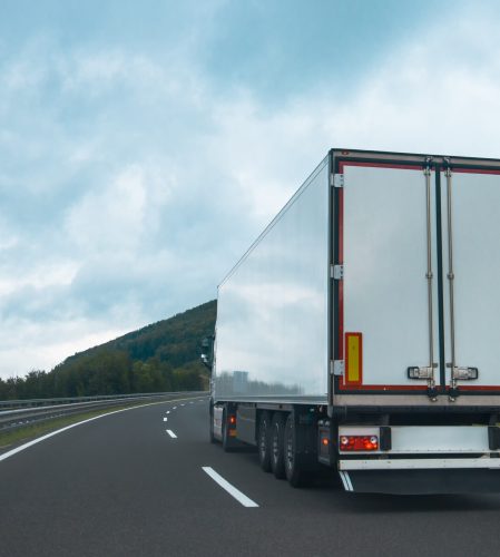 Semi truck with trailer on highway road